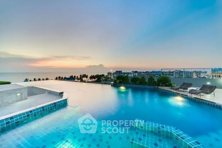 Stunning rooftop infinity pool with breathtaking ocean view at sunset