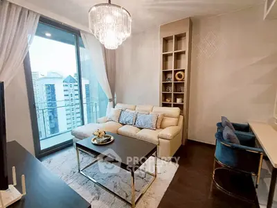 Luxurious living room with elegant decor and city view balcony in modern apartment.