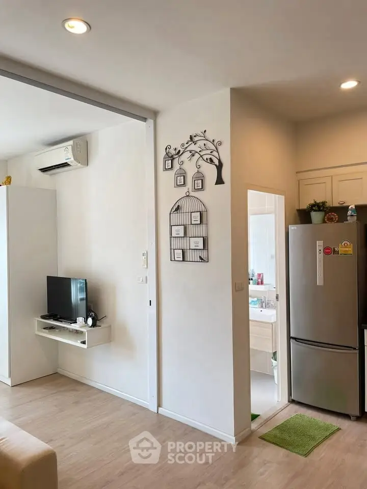 Modern apartment interior with open kitchen and cozy living area