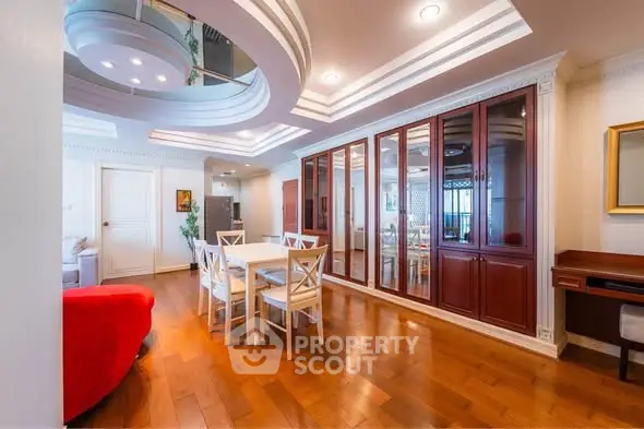 Luxurious dining area with elegant wooden flooring and stylish ceiling design