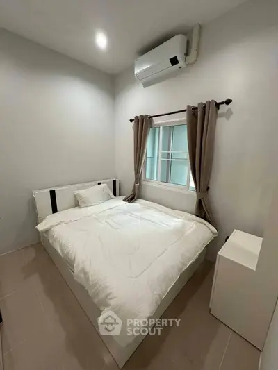Cozy bedroom with modern air conditioning and natural light