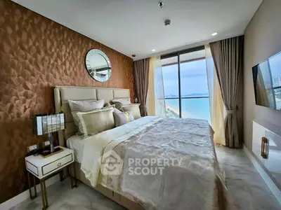 Luxurious bedroom with stunning ocean view and elegant decor