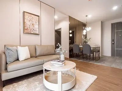 Modern living room with elegant decor and dining area in open layout apartment.
