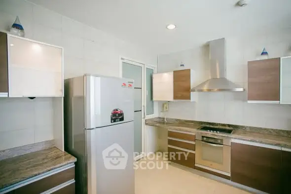 Modern kitchen with stainless steel appliances and sleek cabinetry