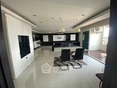 Spacious modern living room with open layout and sleek furnishings, perfect for contemporary living.