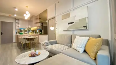 Modern living room with stylish decor and open kitchen layout