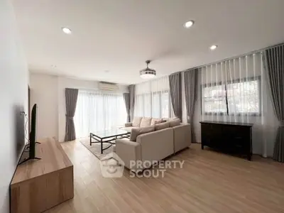 Spacious modern living room with elegant decor and natural light