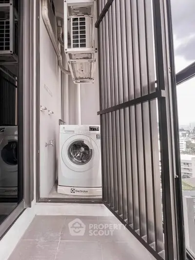 Modern apartment balcony with washing machine and city view
