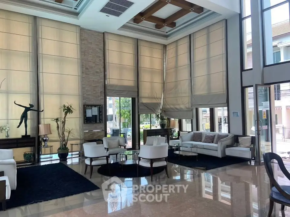 Luxurious modern living room with high ceilings and elegant decor