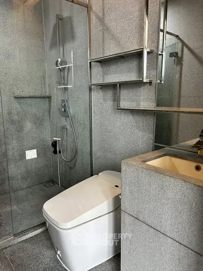 Modern bathroom with sleek design and glass shower enclosure