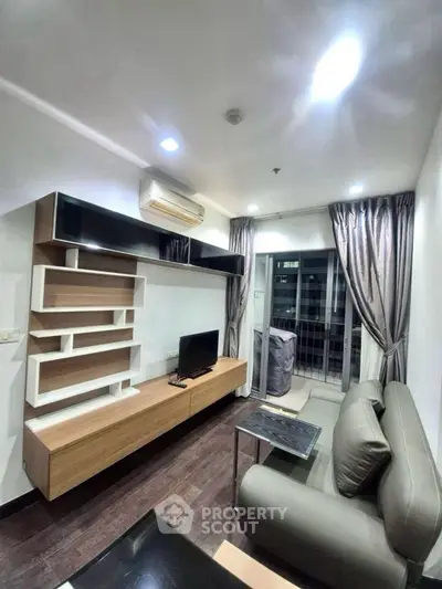 Modern living room with sleek furniture and balcony view