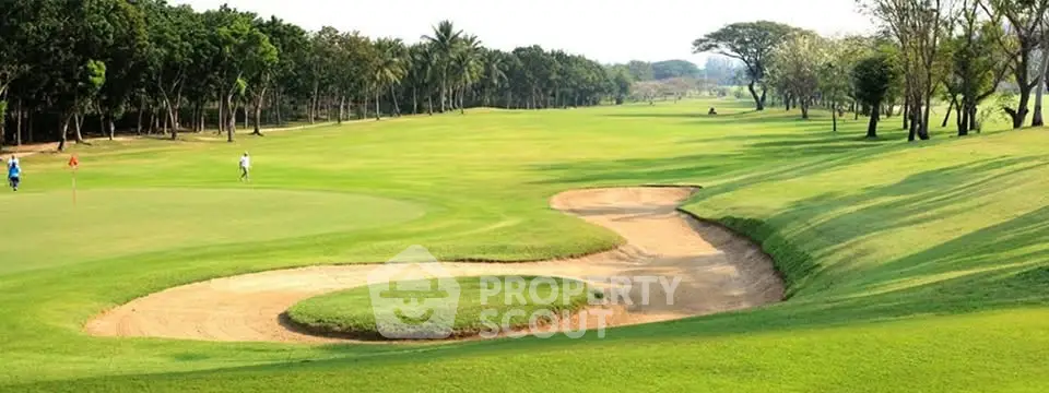 Expansive golf course view with lush greenery and sand bunkers
