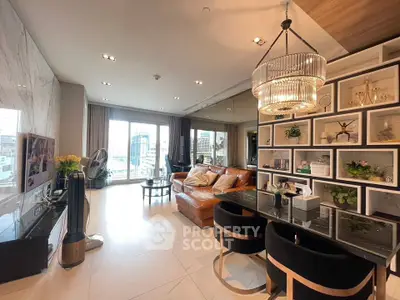 Luxurious living room with elegant decor and spacious layout, featuring a stunning chandelier and modern furnishings.