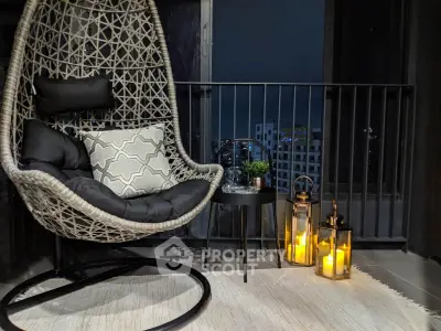 Chic balcony with cozy hanging chair and city view, perfect for relaxation.