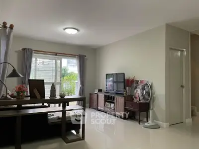 Spacious living room with modern decor and natural light