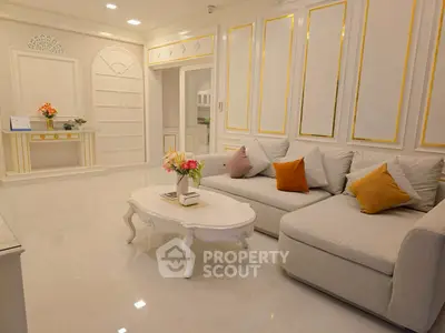 Luxurious living room with elegant decor and plush seating in a modern apartment.