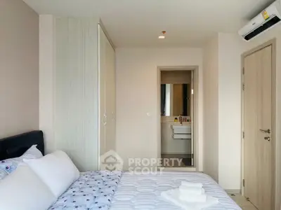 Modern bedroom with ensuite bathroom in a stylish apartment
