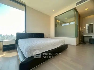 Spacious modern bedroom with city view and stylish interior design