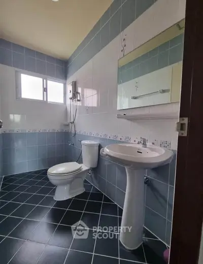 Modern bathroom with sleek tiles and contemporary fixtures