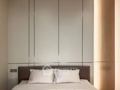 Modern bedroom with sleek paneling and cozy bed setup