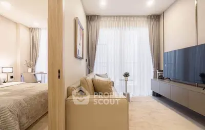 Modern living room with sleek design, large TV, and cozy seating area, perfect for relaxation and entertainment.