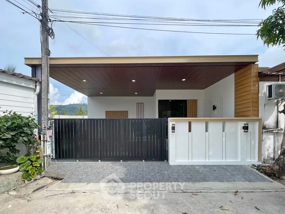 Modern single-story house with sleek design and spacious carport in a serene neighborhood.