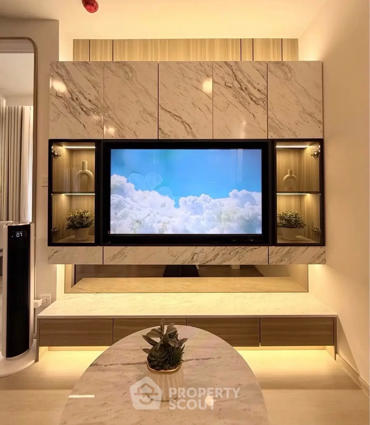 Luxurious living room with modern marble TV wall and elegant decor