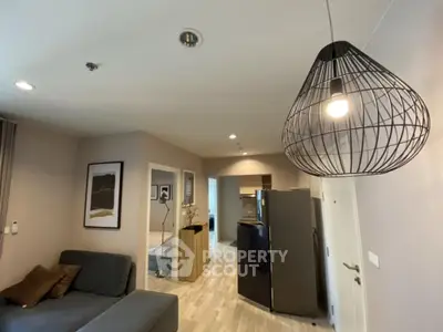 Modern living room with stylish lighting and cozy seating area