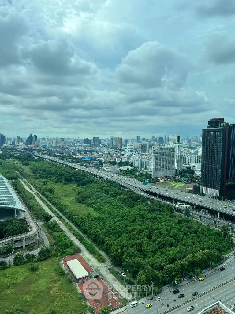 Stunning cityscape view with lush greenery and modern skyline, perfect for urban living.