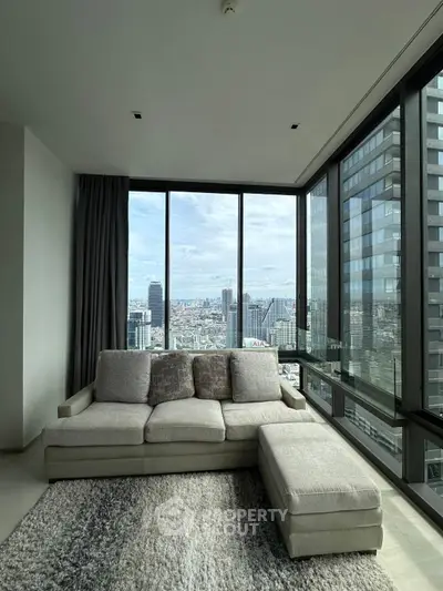 Luxurious corner unit living room with panoramic city views and modern furnishings.