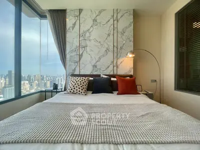 Luxurious bedroom with stunning city view and modern decor
