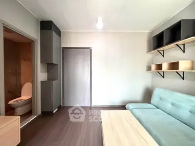 Modern living room with sleek furniture and open bathroom view, perfect for urban living.