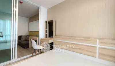 Modern bedroom with sliding glass doors and stylish wooden furniture