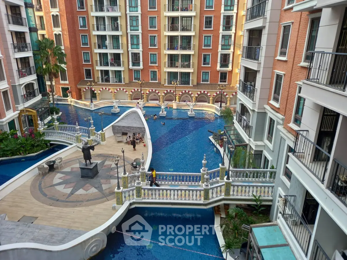 Luxurious apartment complex with stunning pool and elegant architecture