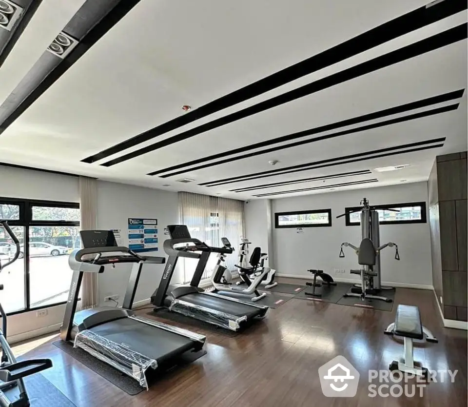 Modern gym with state-of-the-art equipment in a residential building.