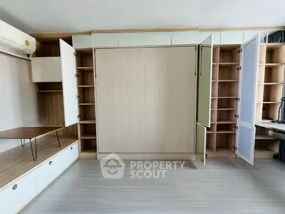 Spacious modern living room with built-in storage and sleek design
