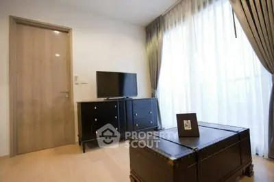 Stylish living room with modern TV stand and elegant curtains