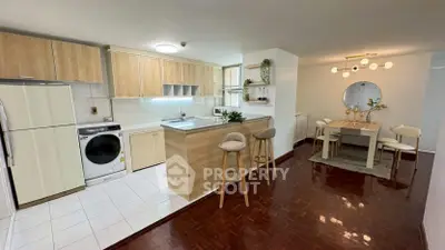 Spacious open-layout kitchen and dining area with modern appliances and stylish decor.