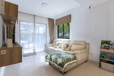 Bright and cozy living room with modern decor and large windows