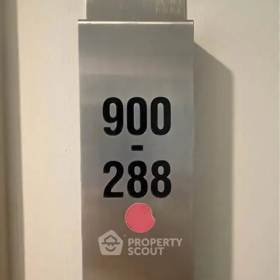 Modern elevator panel with floor numbers in sleek building