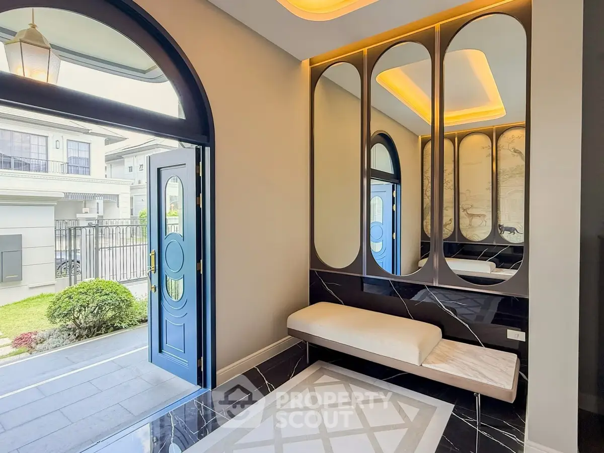 Elegant entrance with modern design and stylish mirrors