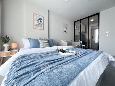 Modern bedroom with stylish decor and cozy blue accents