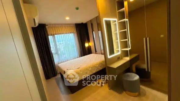 Modern bedroom with stylish lighting and large window in a contemporary apartment.