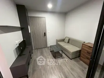 Modern living room with sleek furniture and stylish decor in a contemporary apartment.