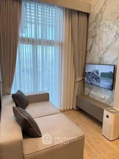 Luxurious living room with floor-to-ceiling windows and modern decor in high-rise apartment.