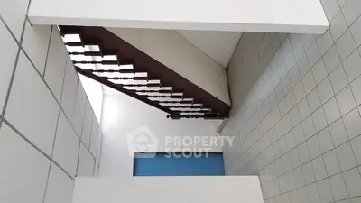 Modern staircase with sleek design in a contemporary building interior.