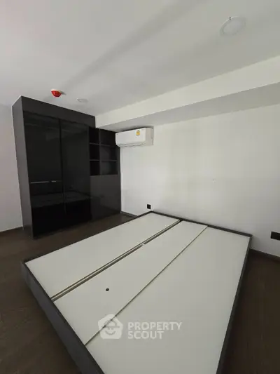 Modern bedroom with sleek design and built-in wardrobe