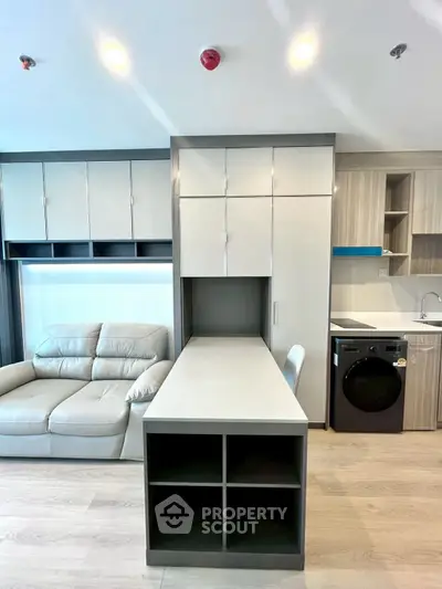 Modern living room with sleek furniture and built-in storage solutions