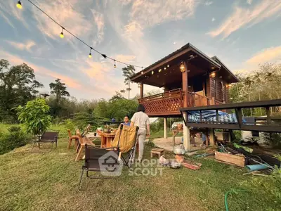 Charming rustic cabin with outdoor seating and lush greenery, perfect for nature lovers seeking tranquility.