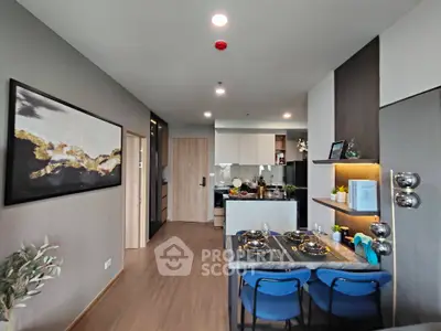 Modern open-layout kitchen with stylish dining area and contemporary decor.